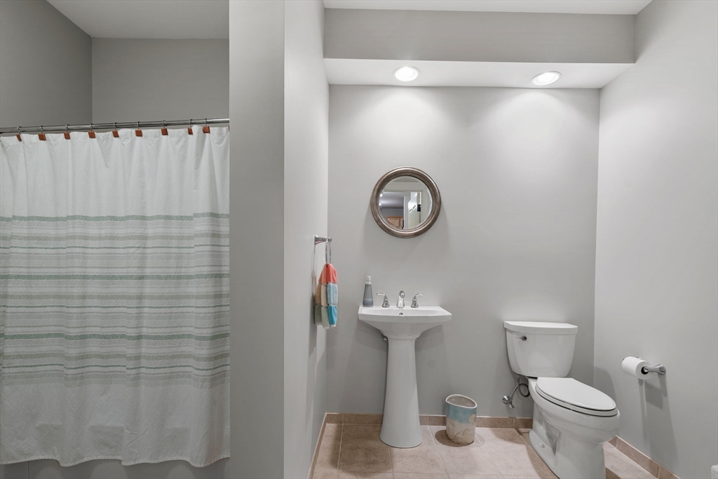59 Walpole Street, Unit 210 Canton, MA 02021 - Photo 23 of 42 a bathroom with a toilet and a sink