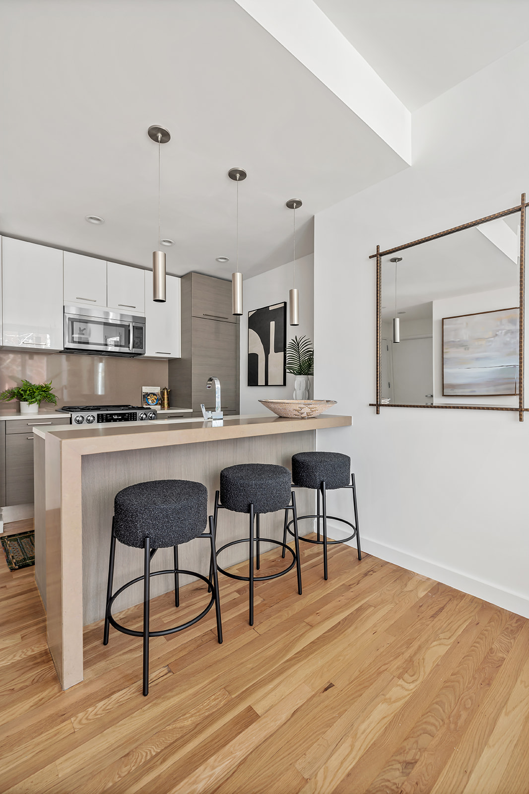 333 East 109th Street, Unit 2A Manhattan, NY 10029 - Photo 2 of 9 a living room with stainless steel appliances kitchen island granite countertop furniture and wooden floor