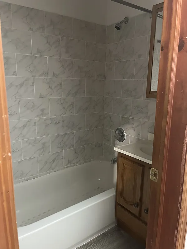 571 Nostrand Avenue, Unit 3R Brooklyn, NY 11216 - Photo 5 of 7 a bathroom with a bathtub