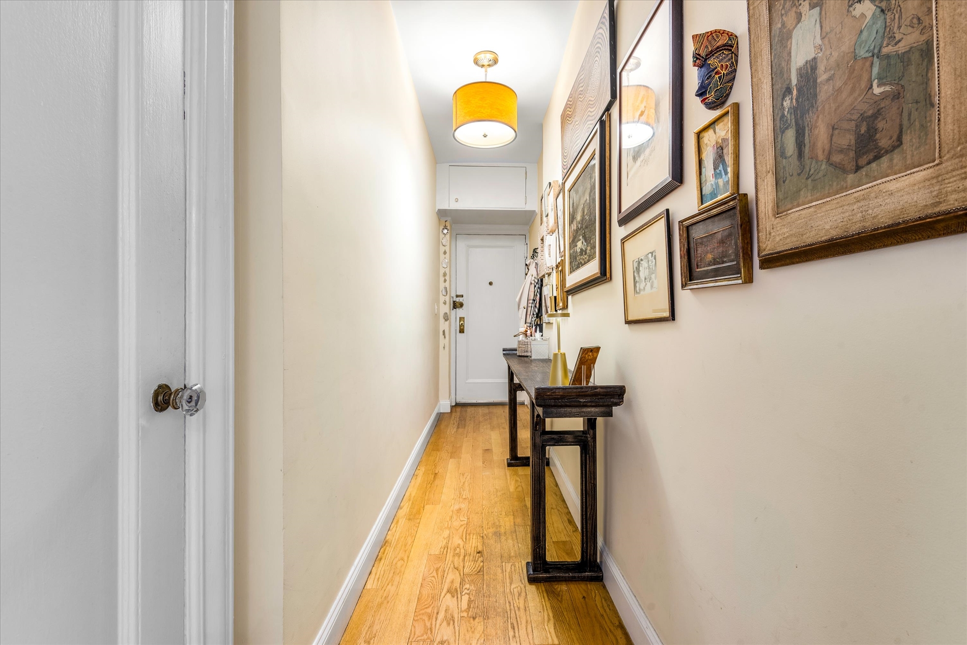 345 East 77th Street, Unit 3C Manhattan, NY 10075 - Photo 14 of 19 a bathroom with a sink and mirror