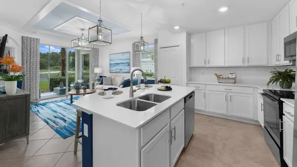 a kitchen with a sink stove and cabinets