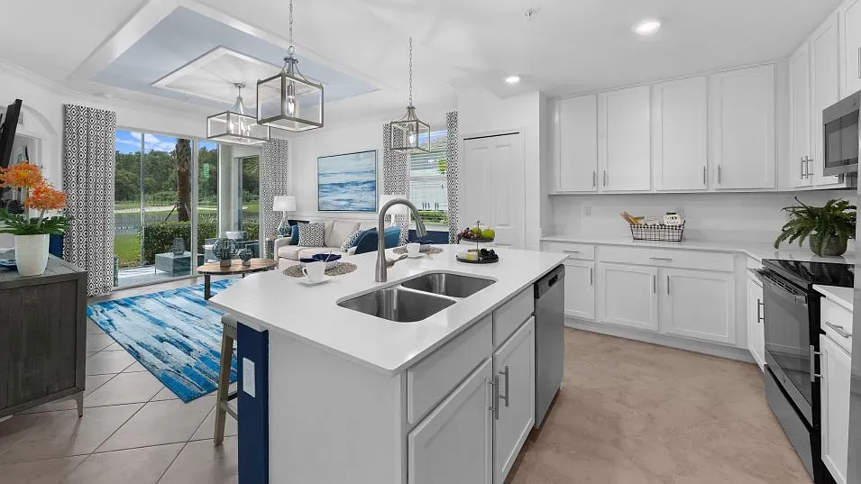 a kitchen with a sink stove and cabinets