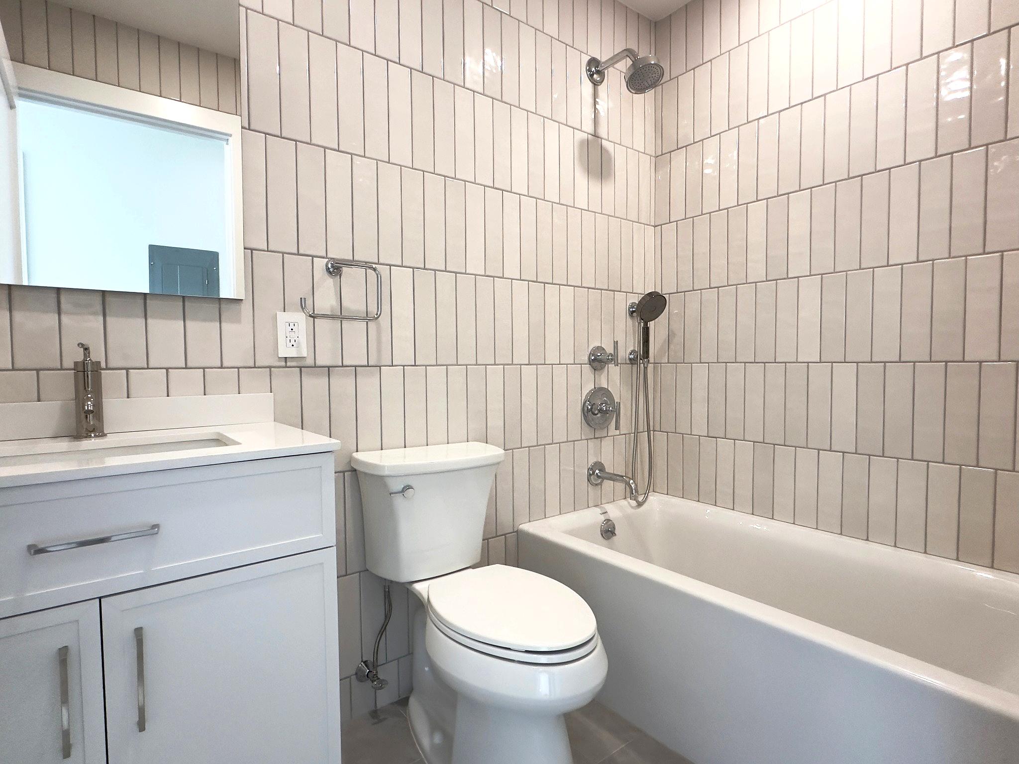 156 Summit Street, Unit 1 Brooklyn, NY 11231 - Photo 4 of 6 a bathroom with a sink a toilet and bathtub