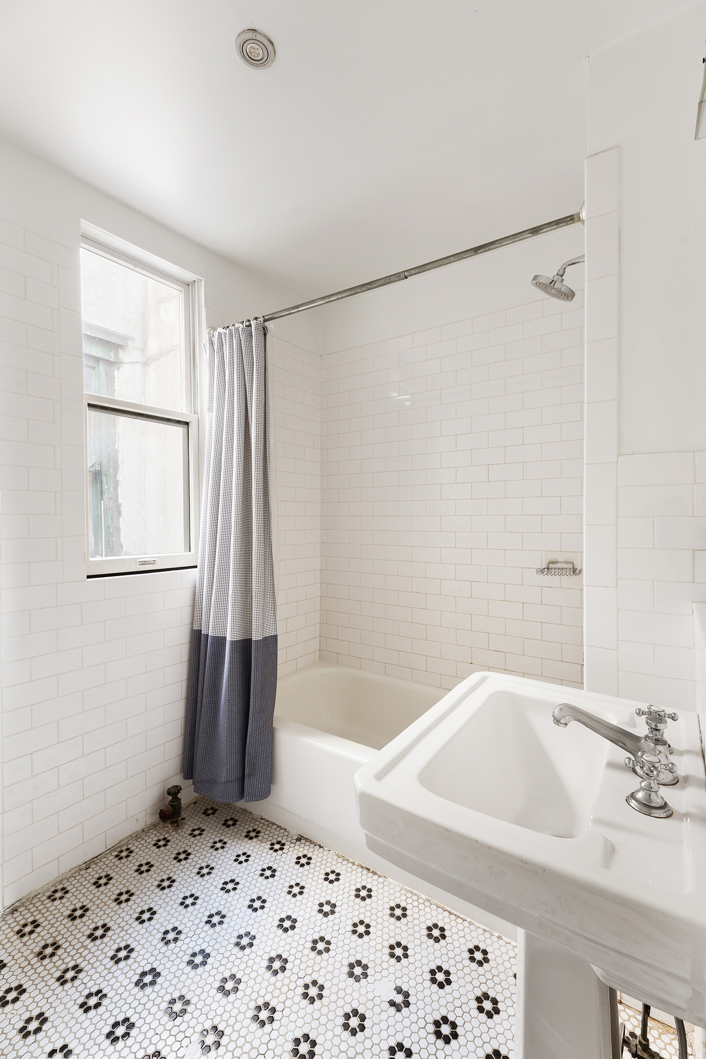 147 Sullivan Street, Unit 5C Manhattan, NY 10012 - Photo 4 of 6 a bathroom with a bathtub and a shower