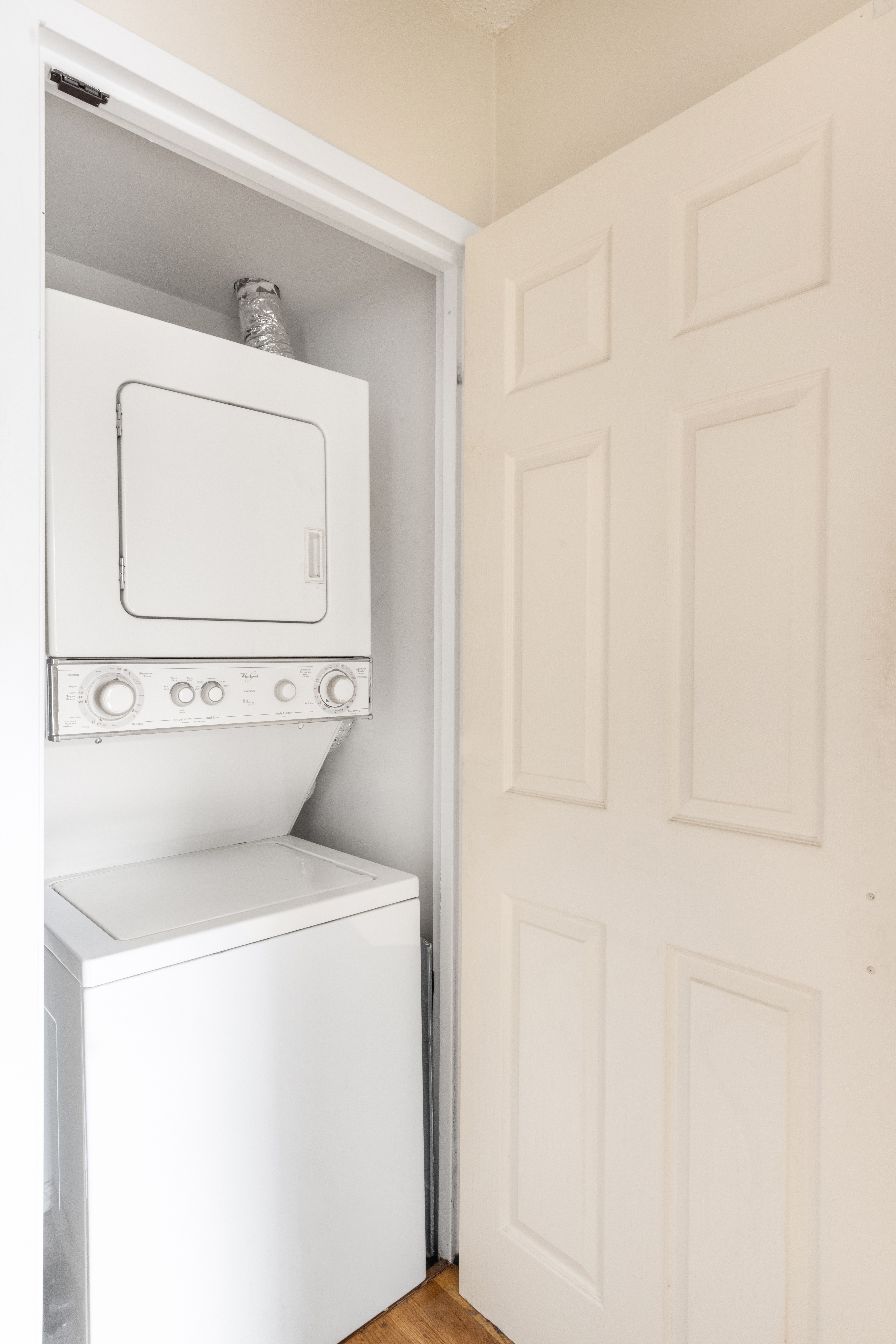 226 West 123rd Street, Unit 2 Manhattan, NY 10027 - Photo 8 of 9 a utility room with dryer and washer