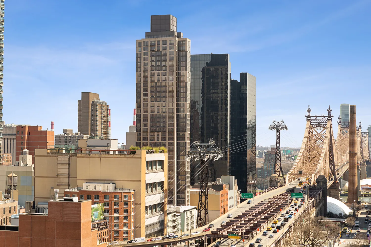 a view of city with tall buildings