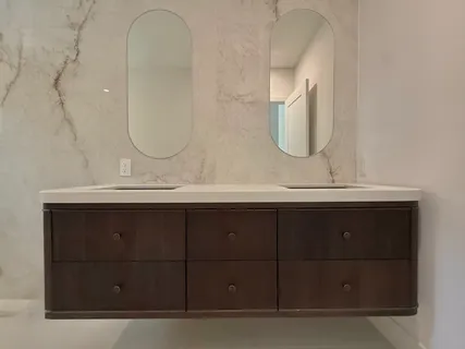 a bathroom with a sink vanity and a mirror