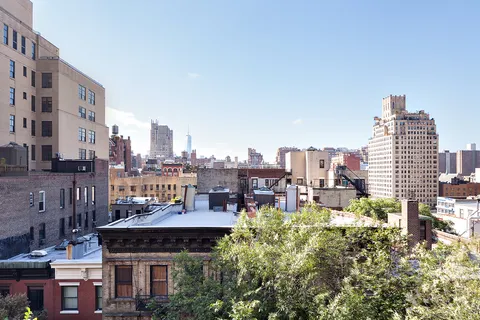 a view of a city with tall buildings