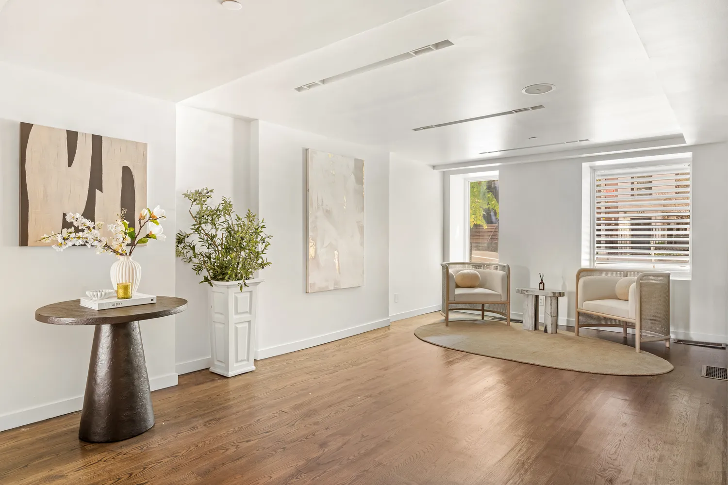a dining room with furniture and wooden floor