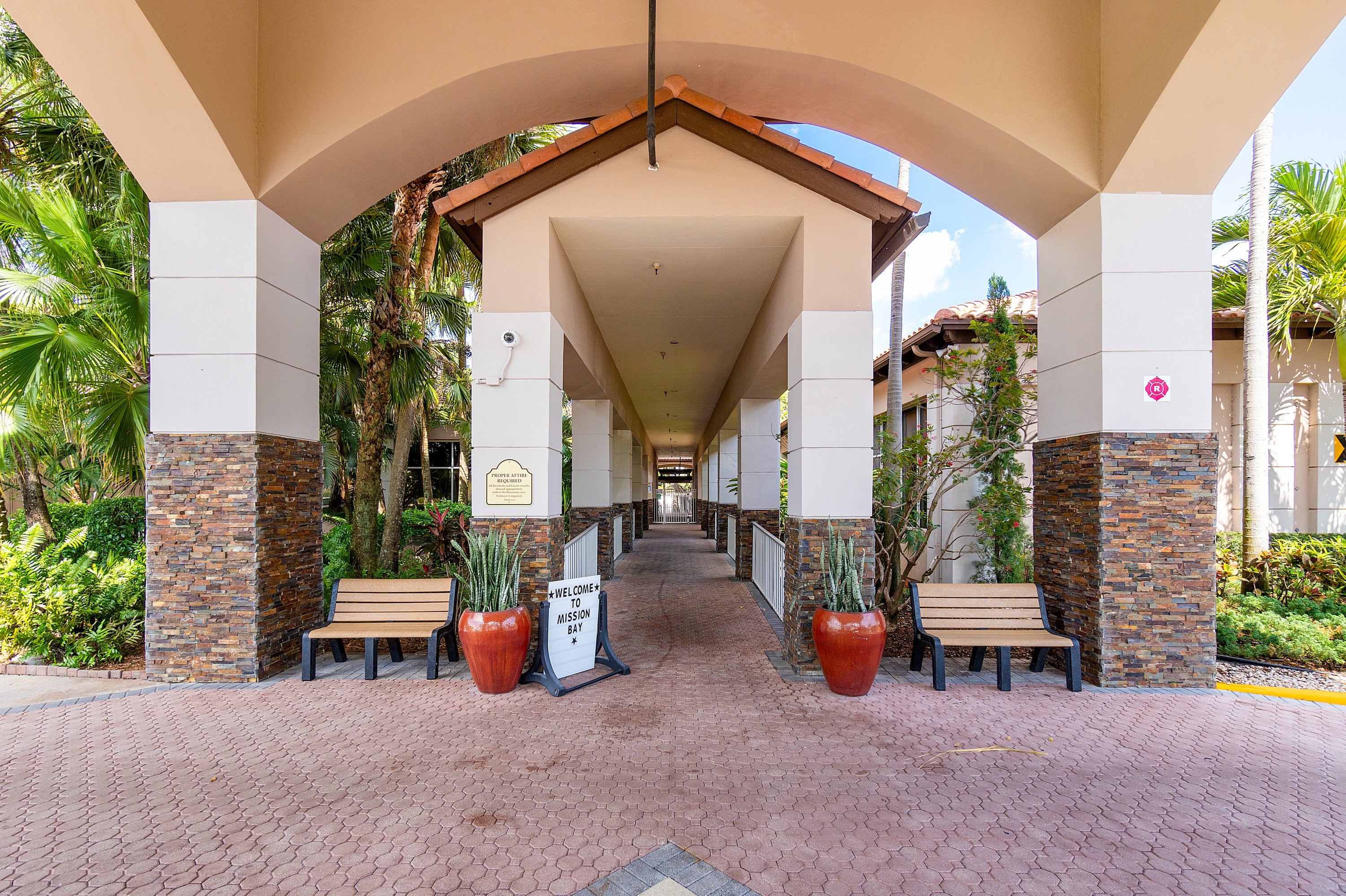 20317 Hacienda Court Boca Raton, FL 33498 - Photo 79 of 100 a view of a porch with chairs and potted plants