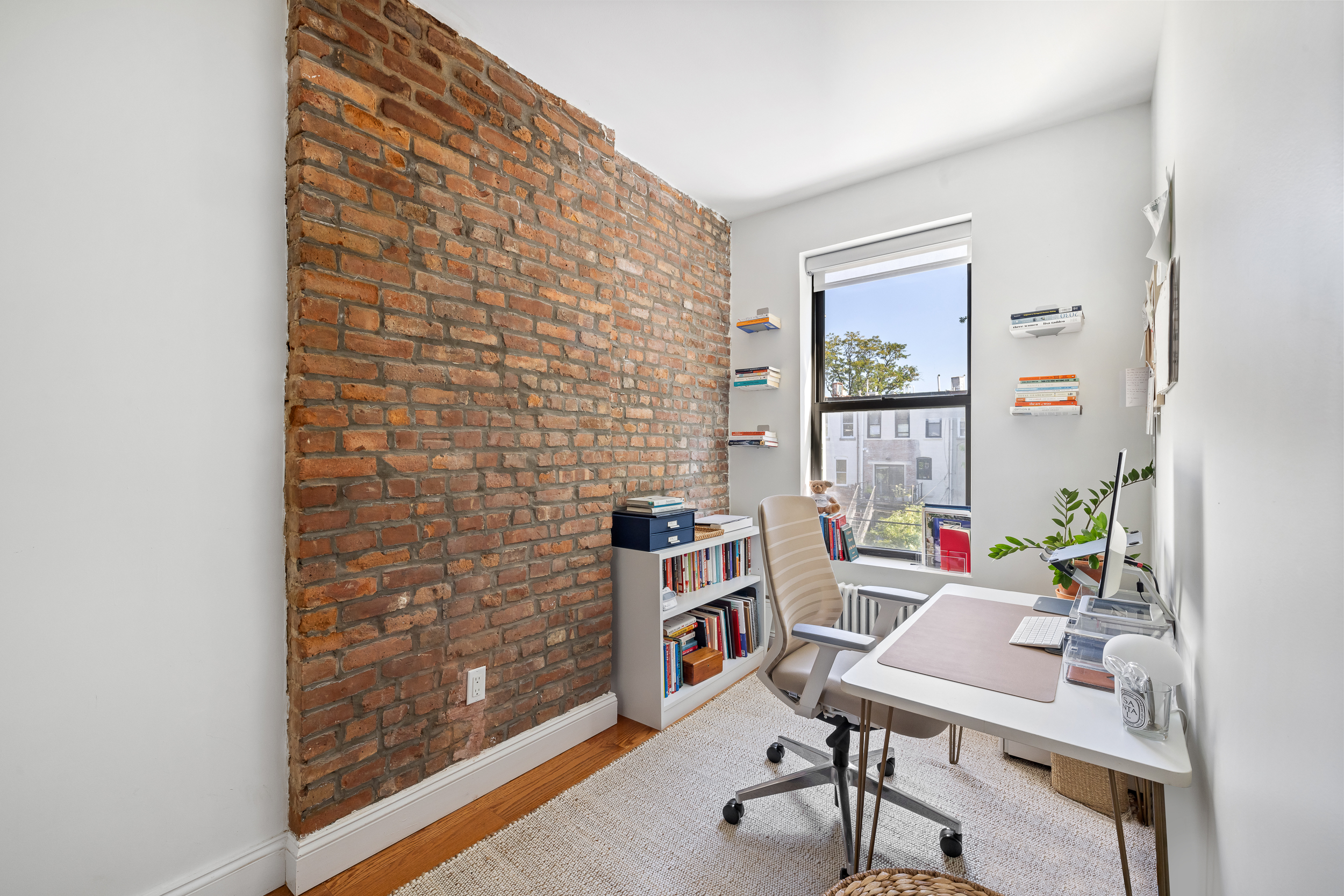 716 Monroe Street Brooklyn, NY 11221 - Photo 12 of 22 a workspace with furniture and a window
