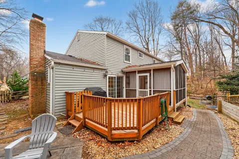 a view of a house with a wooden fence