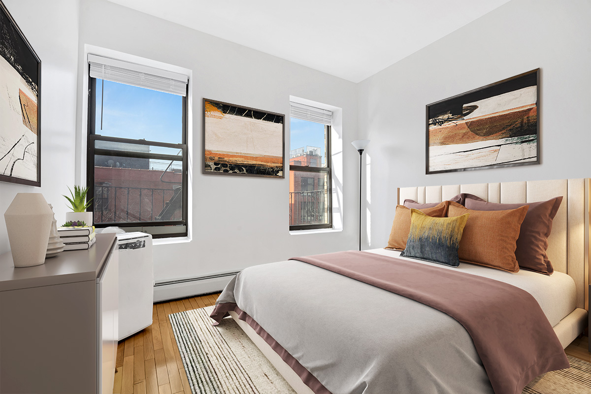 277 Nostrand Avenue, Unit 3A Brooklyn, NY 11216 - Photo 6 of 10 a bedroom with a bed and a flat tv screen on dresser