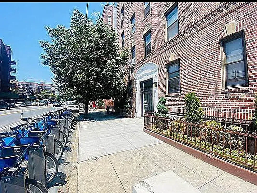 a view of house with outdoor space and sitting area
