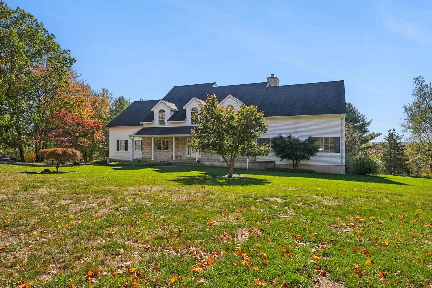 a front view of a house with a yard