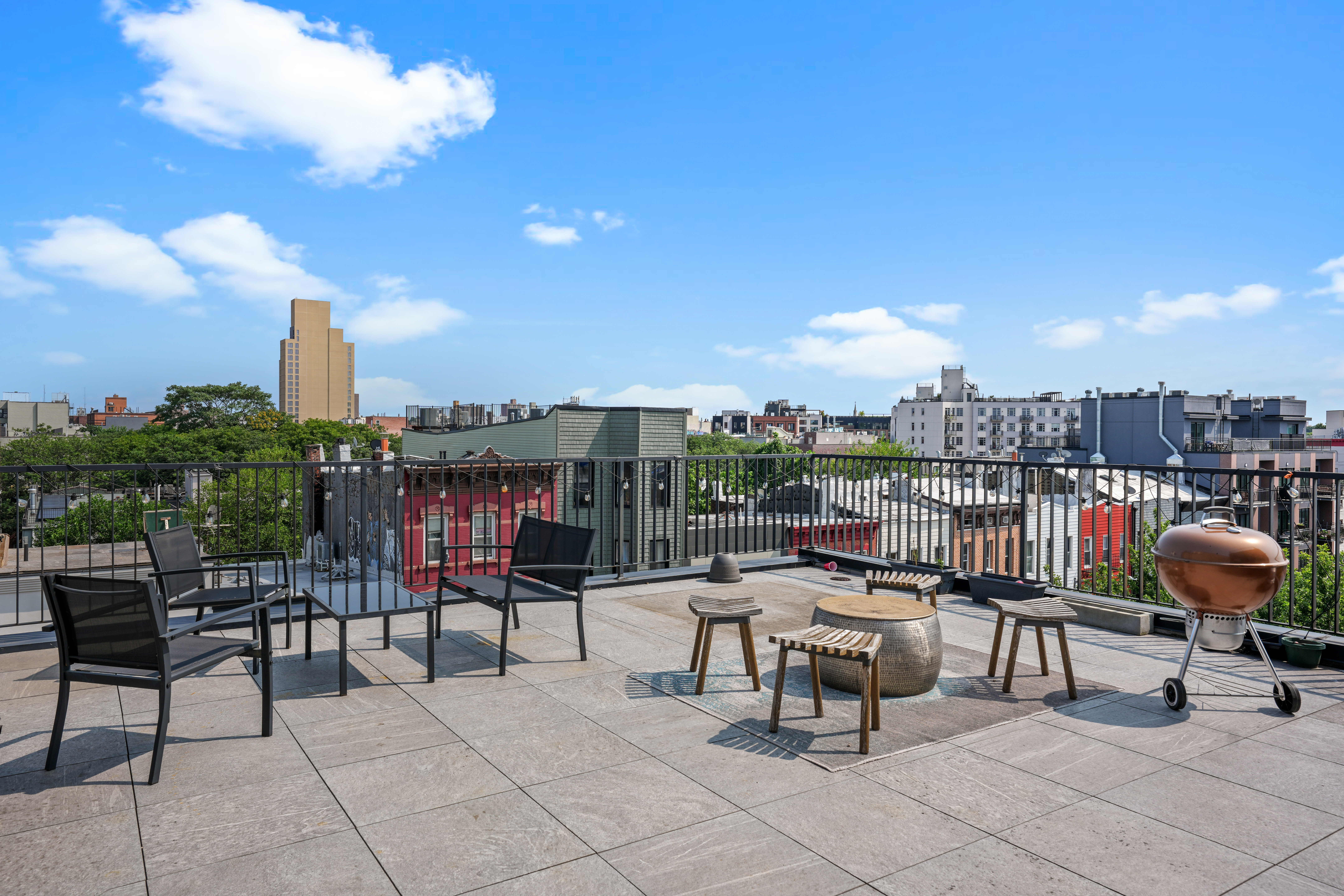 1143 Lafayette Avenue, Unit 4B Brooklyn, NY 11221 - Photo 7 of 9 a view of a terrace with furniture and a fire pit