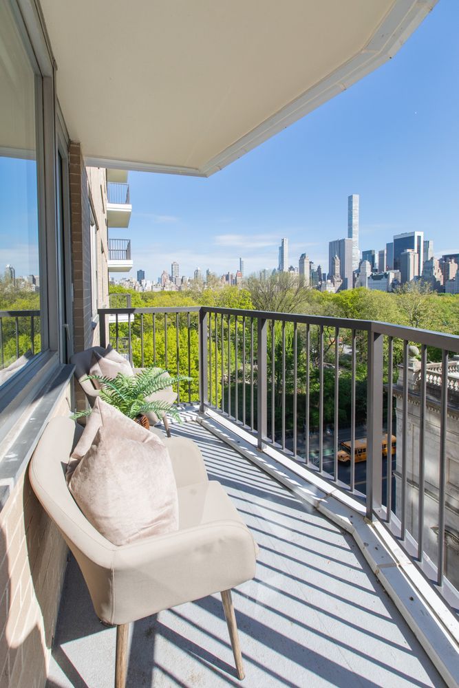a balcony with furniture and garden