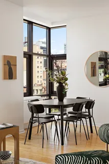 a bathroom with a sink a large mirror and a bathtub