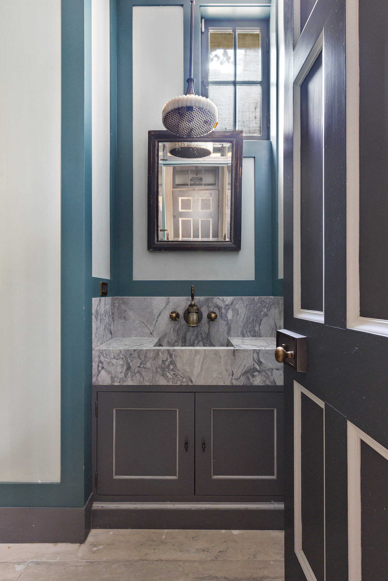 68 Morton Street Manhattan, NY 10014 - Photo 15 of 21 a bathroom with a granite countertop sink and a mirror