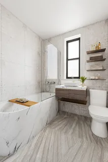 a bathroom with a bathtub and a sink