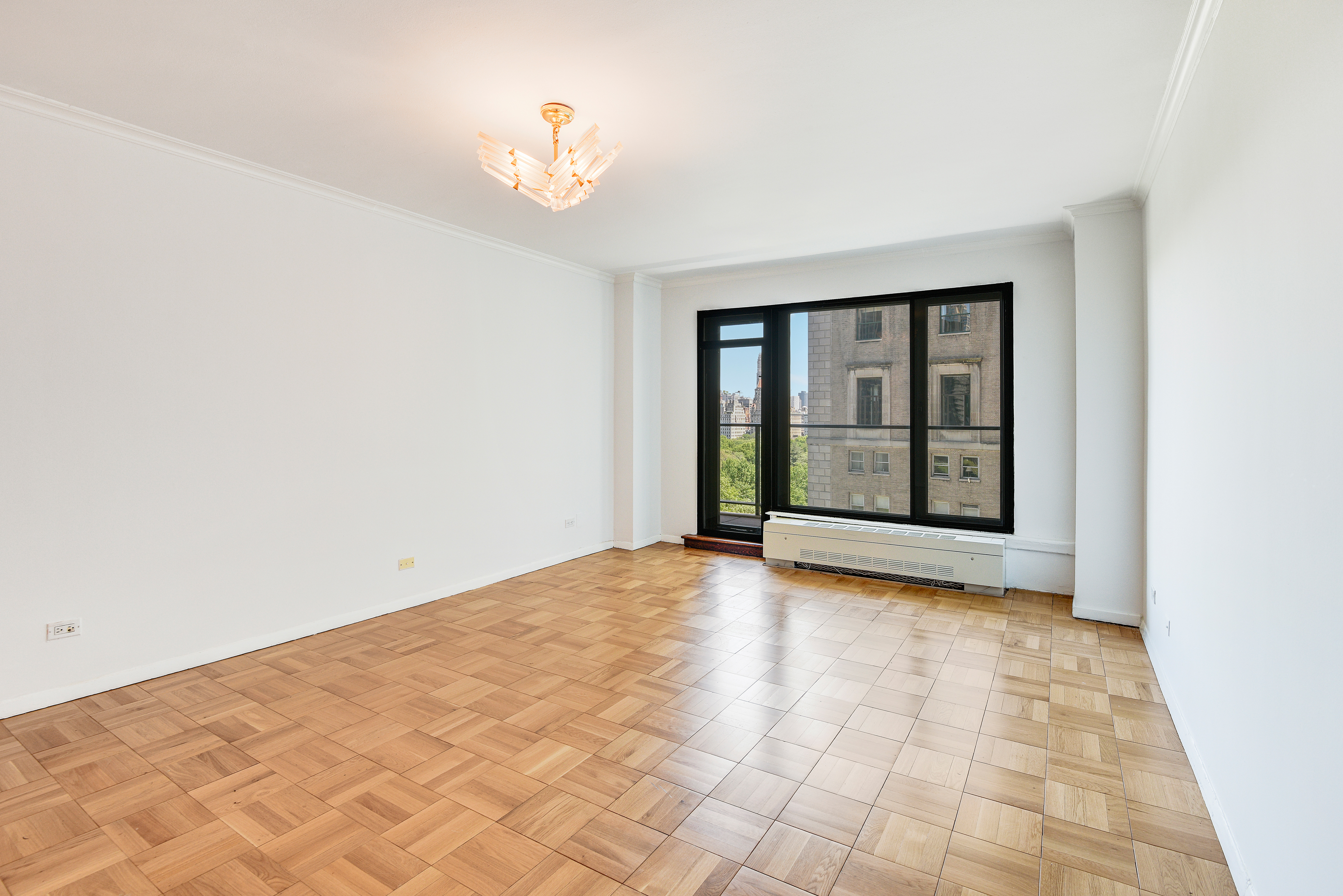 200 Central Park South, Unit 14B Manhattan, NY 10019 - Photo 11 of 17 a view of an empty room with a window