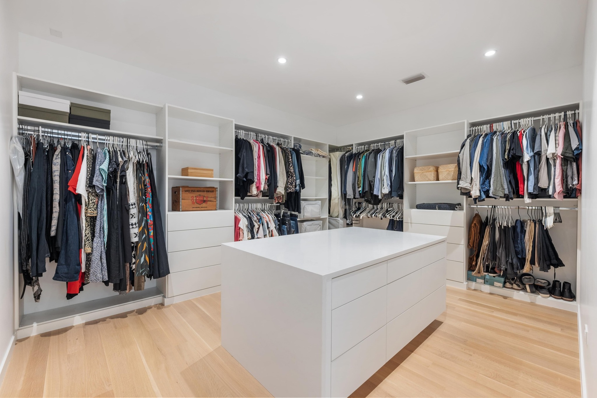 1206 Bickler Road Austin, TX 78704 - Photo 38 of 65 a view of walk in closet with clothes and shoes