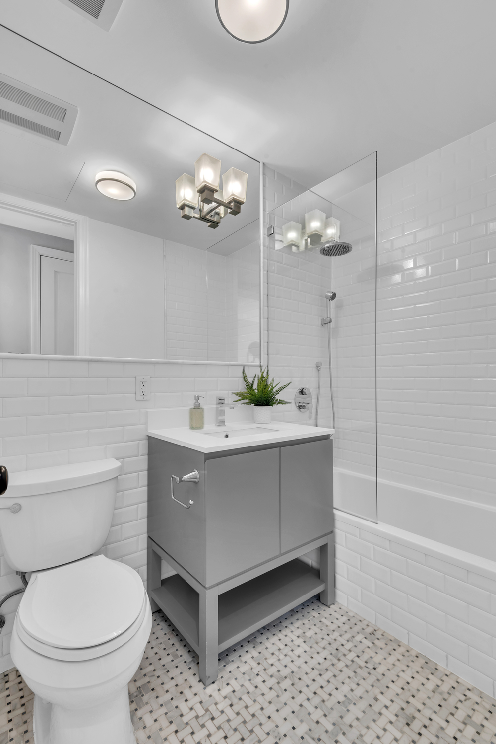 94 Lefferts Place, Unit 2 Brooklyn, NY 11238 - Photo 8 of 10 a bathroom with a sink a toilet and a mirror