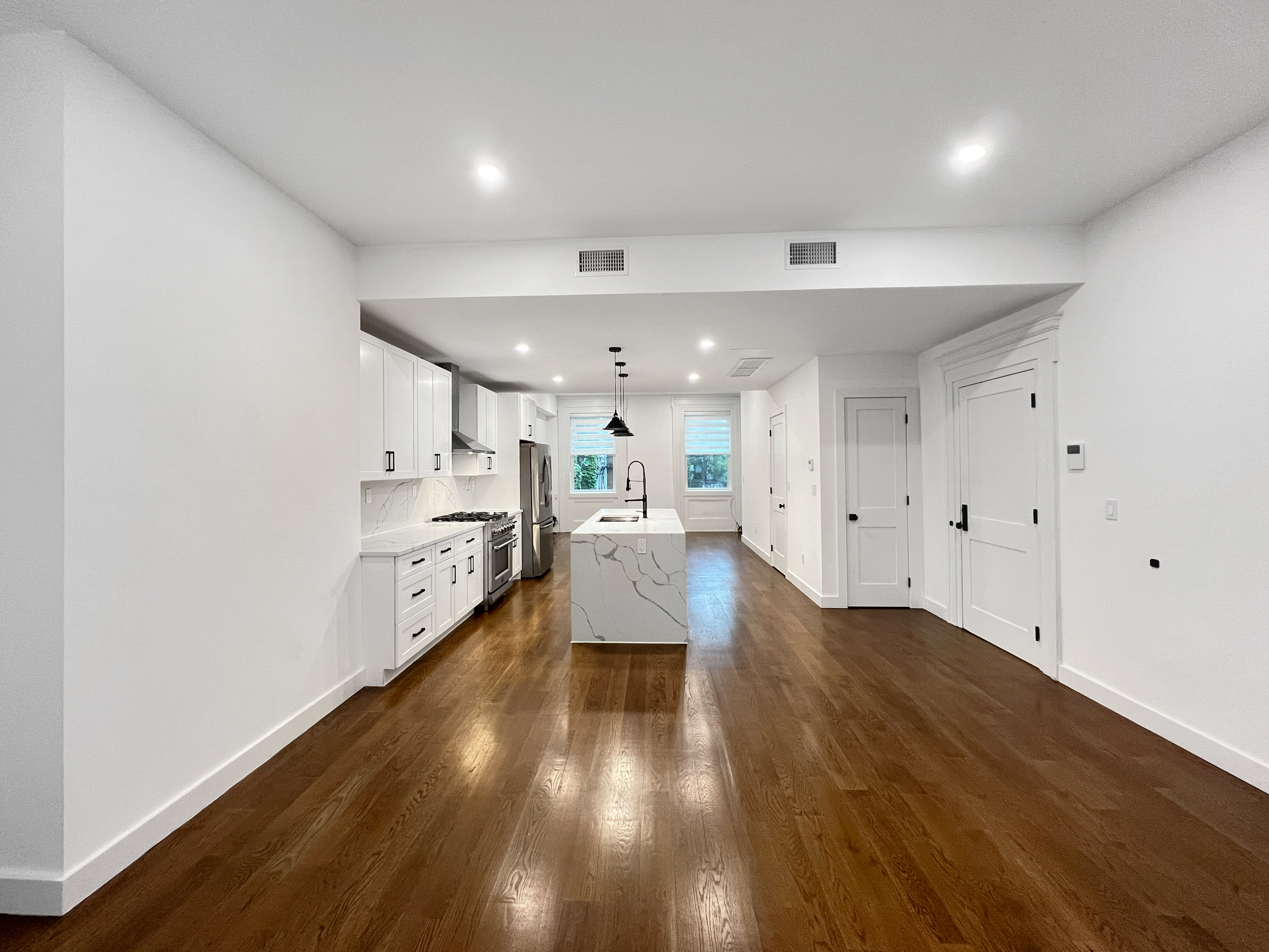 352 Degraw Street, Unit 1 Brooklyn, NY 11231 - Photo 4 of 20 a view of a big room with wooden floor and windows
