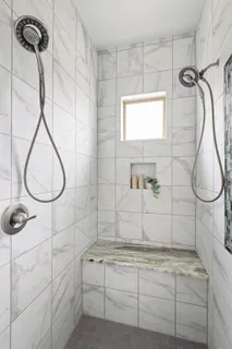 a view of a yard with plants and trees