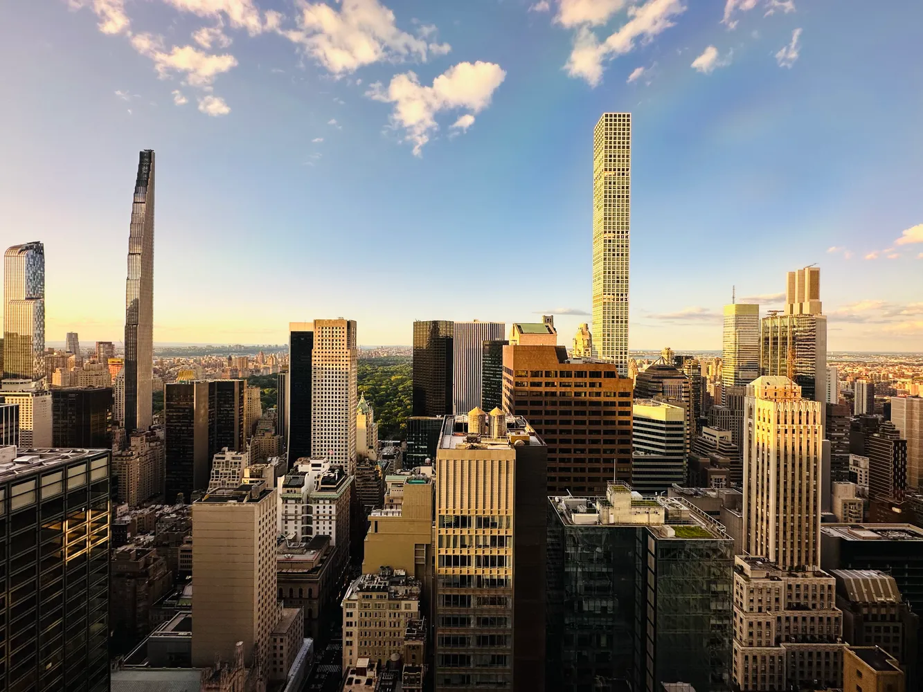 a bedroom with furniture and a large window