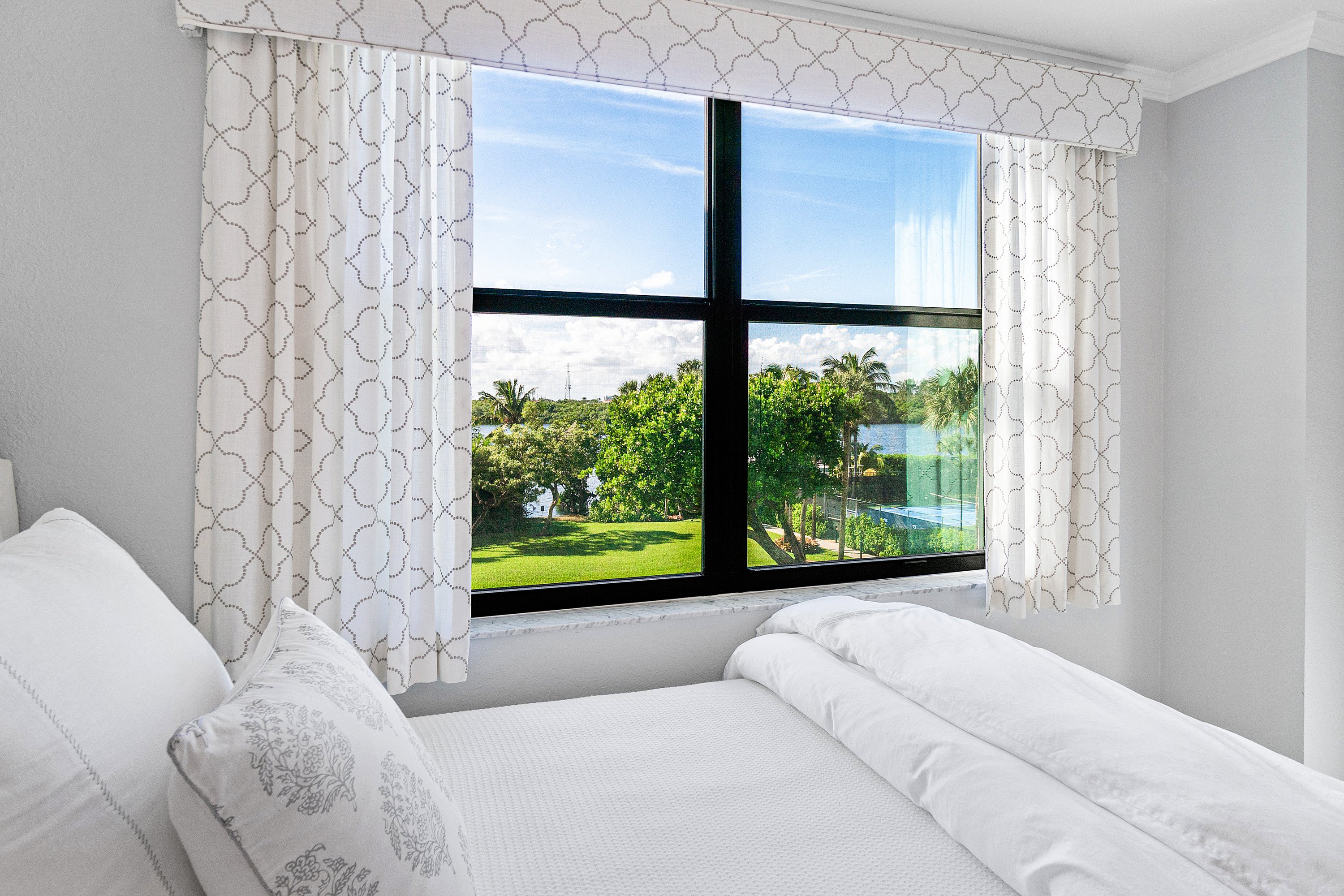 2003 North Ocean Boulevard, Unit 305 Boca Raton, FL 33431 - Photo 38 of 56 a living room with furniture and a large window
