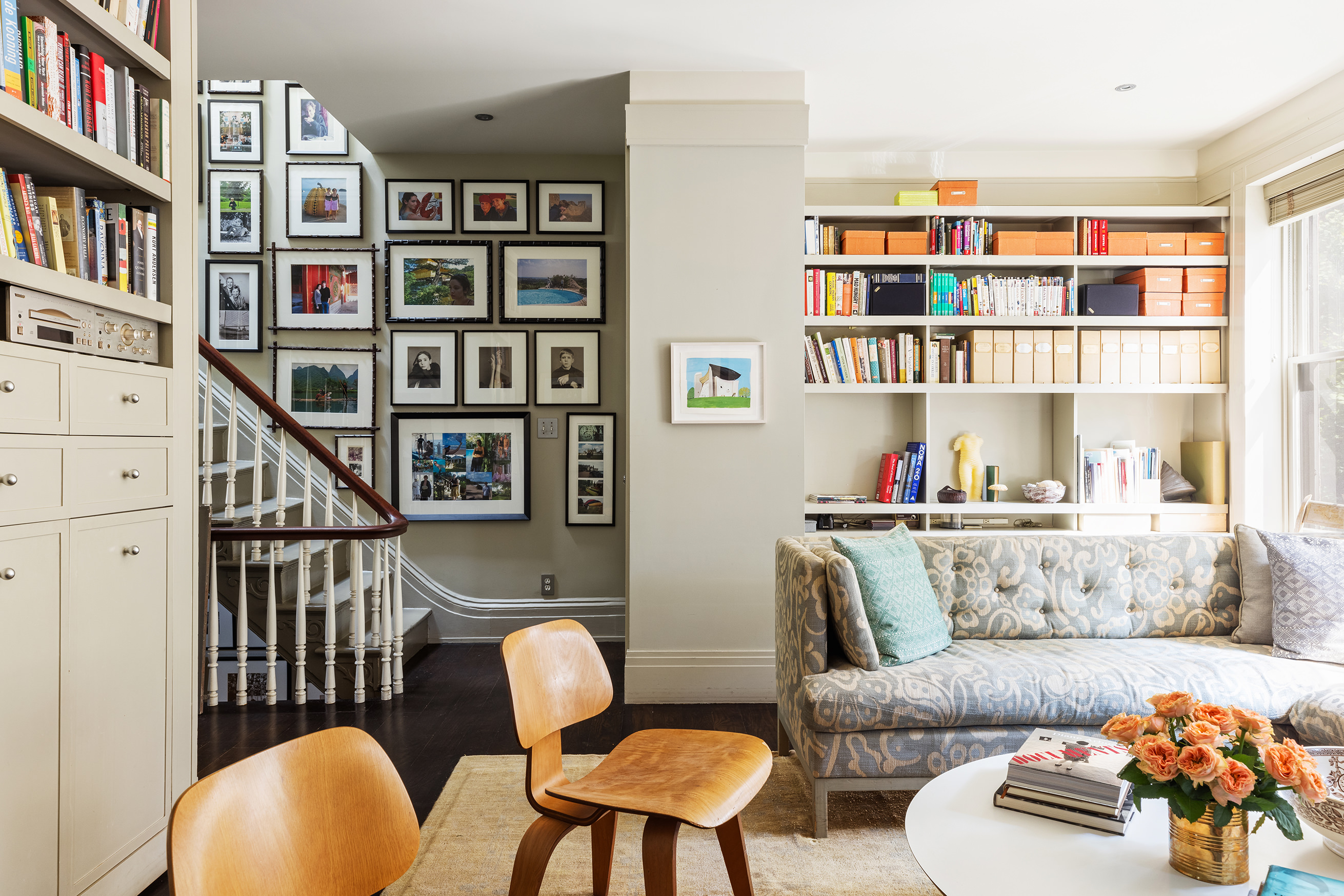 25 Perry Street Manhattan, NY 10014 - Photo 13 of 32 a living room with furniture and a book shelf