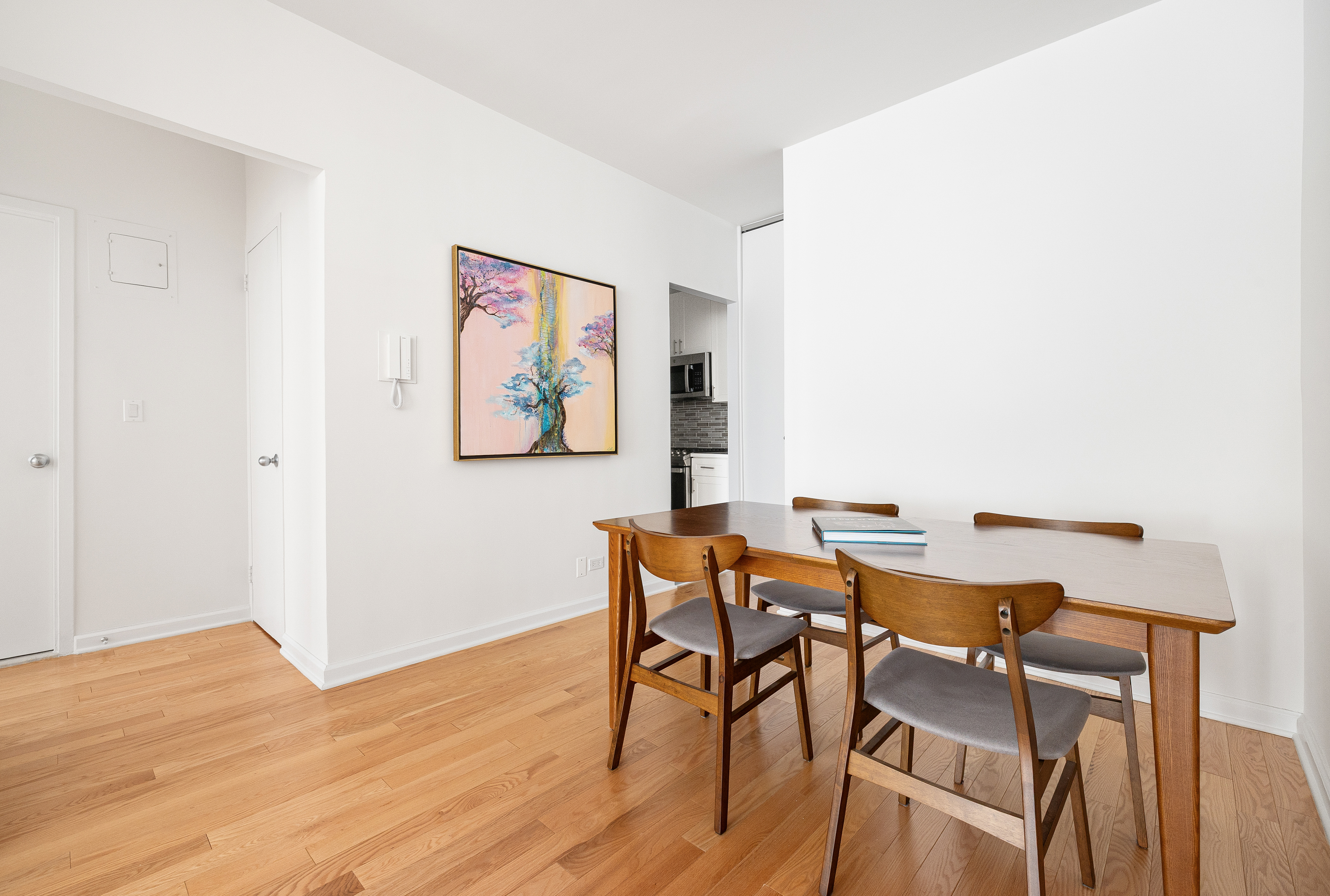 60 East 8th Street, Unit 15P Manhattan, NY 10003 - Photo 4 of 17 a view of a dining room with furniture and wooden floor