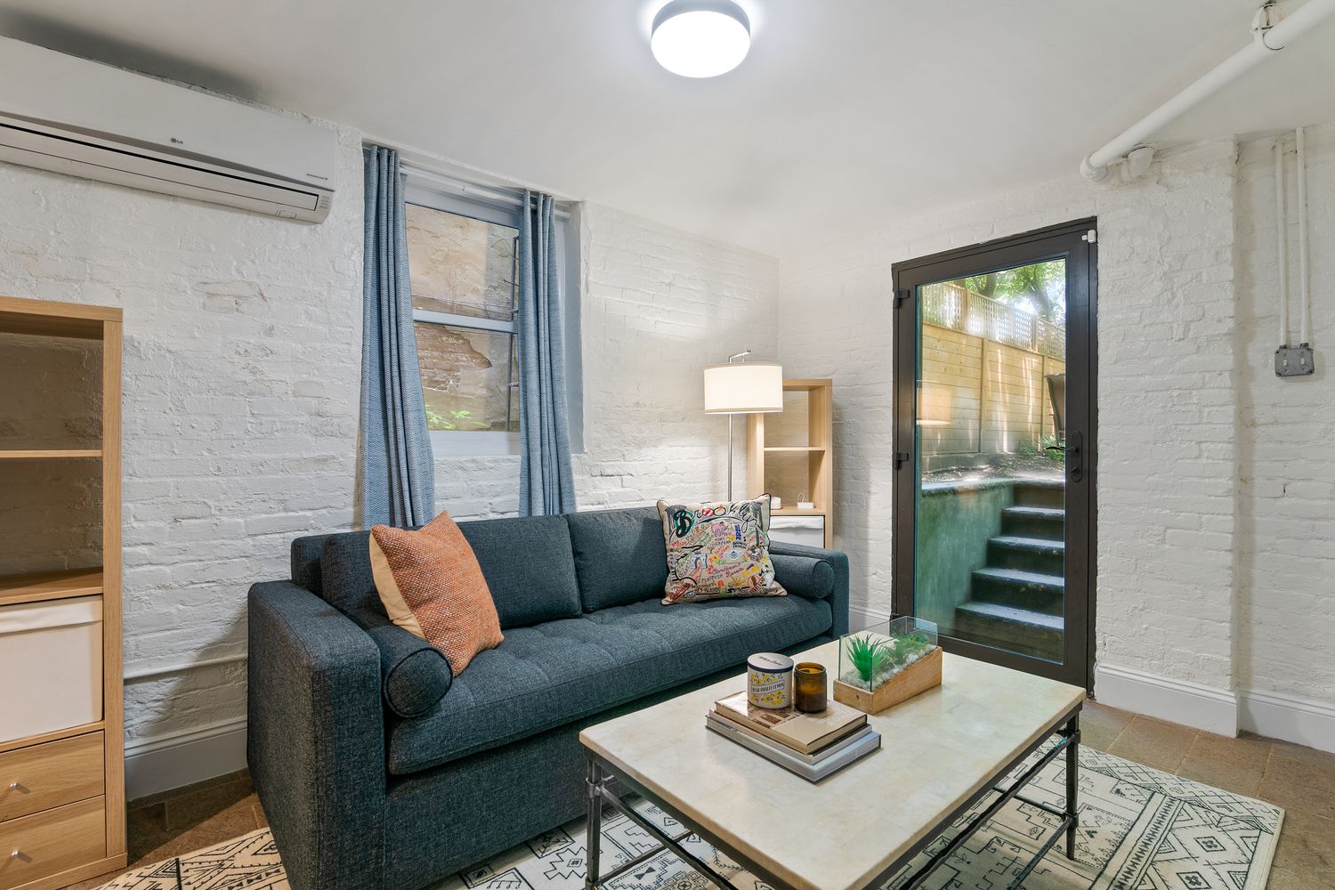 a living room with furniture and a window