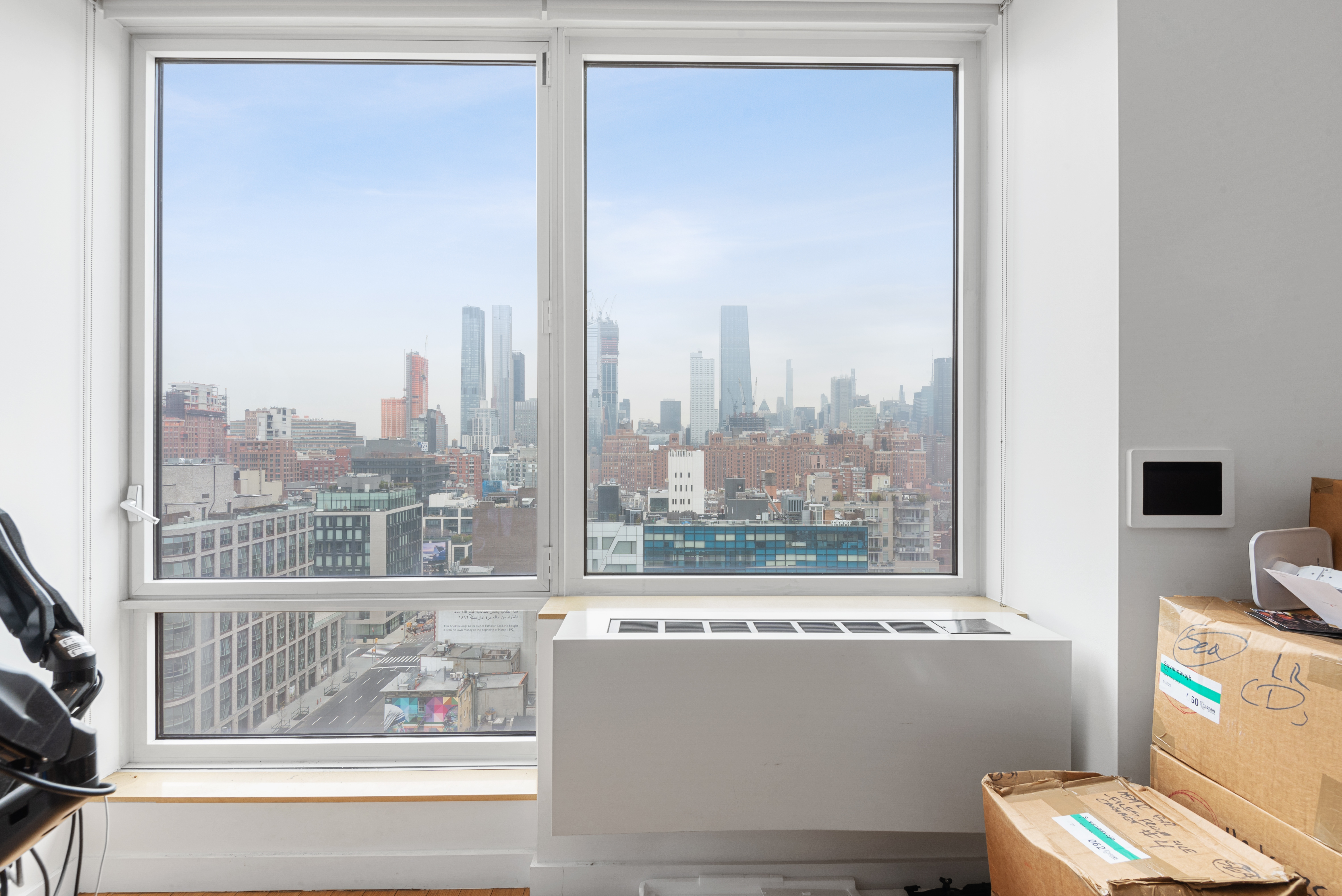 450 West 17th Street, Unit 1811 Manhattan, NY 10011 - Photo 2 of 14 a view of a living room and a window