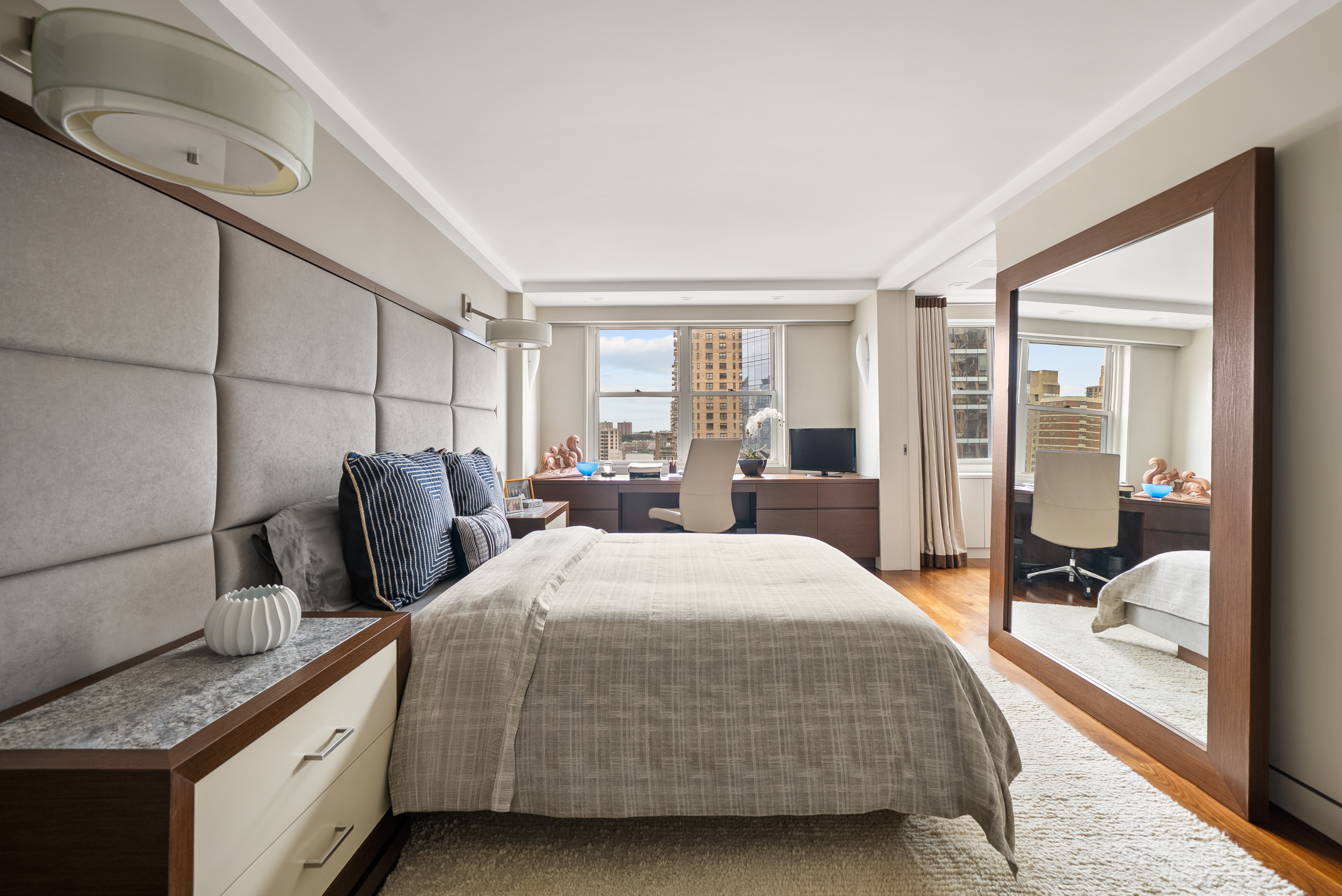 165 West 66th Street, Unit 18D Manhattan, NY 10023 - Photo 4 of 8 a bedroom with a bed and large window with balcony view