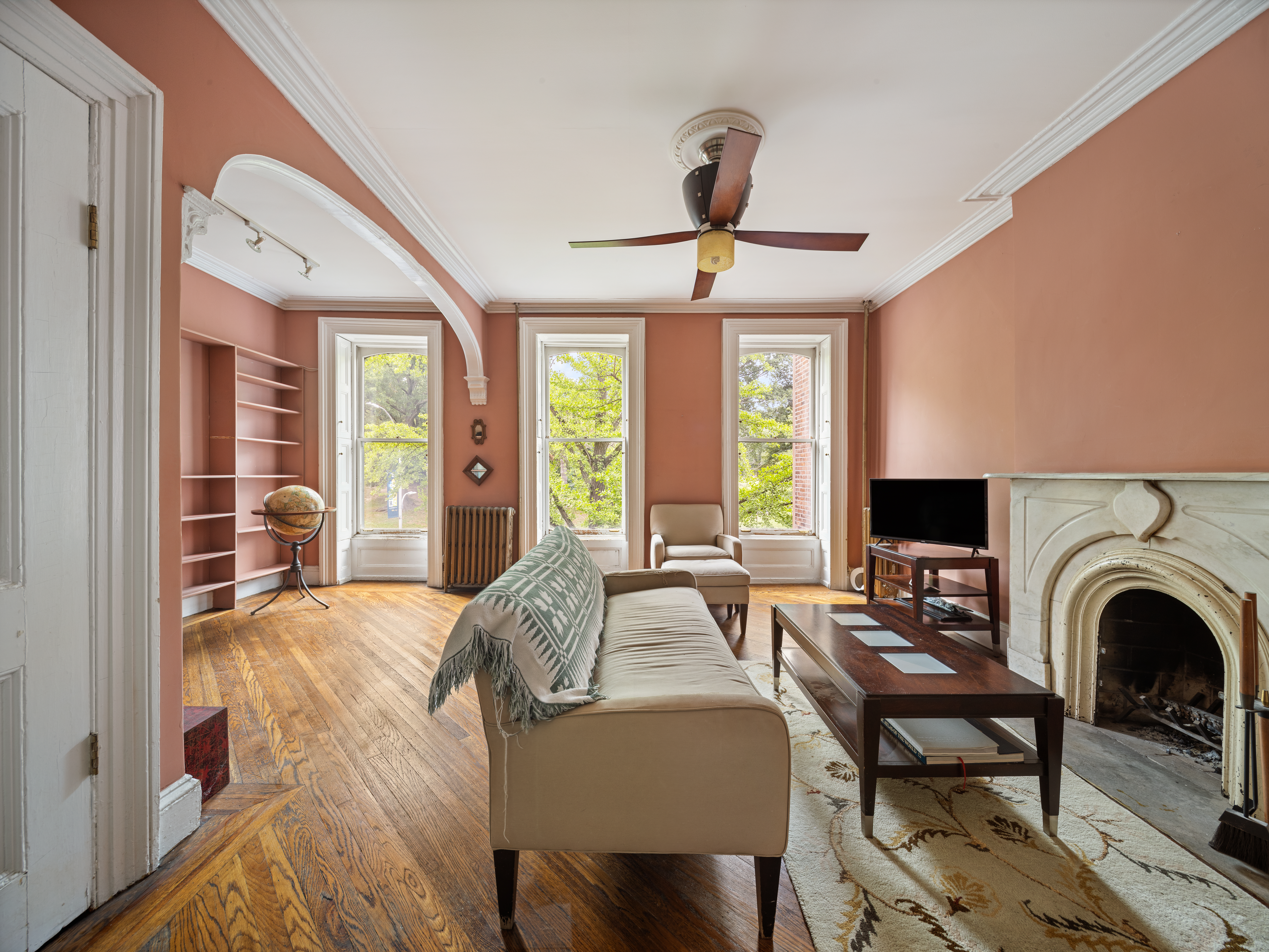 152 Dekalb Avenue Brooklyn, NY 11217 - Photo 14 of 27 a spacious bedroom with a bed and a fireplace