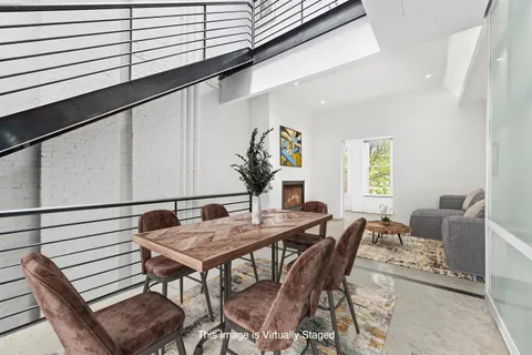 a view of a dining room with furniture and window