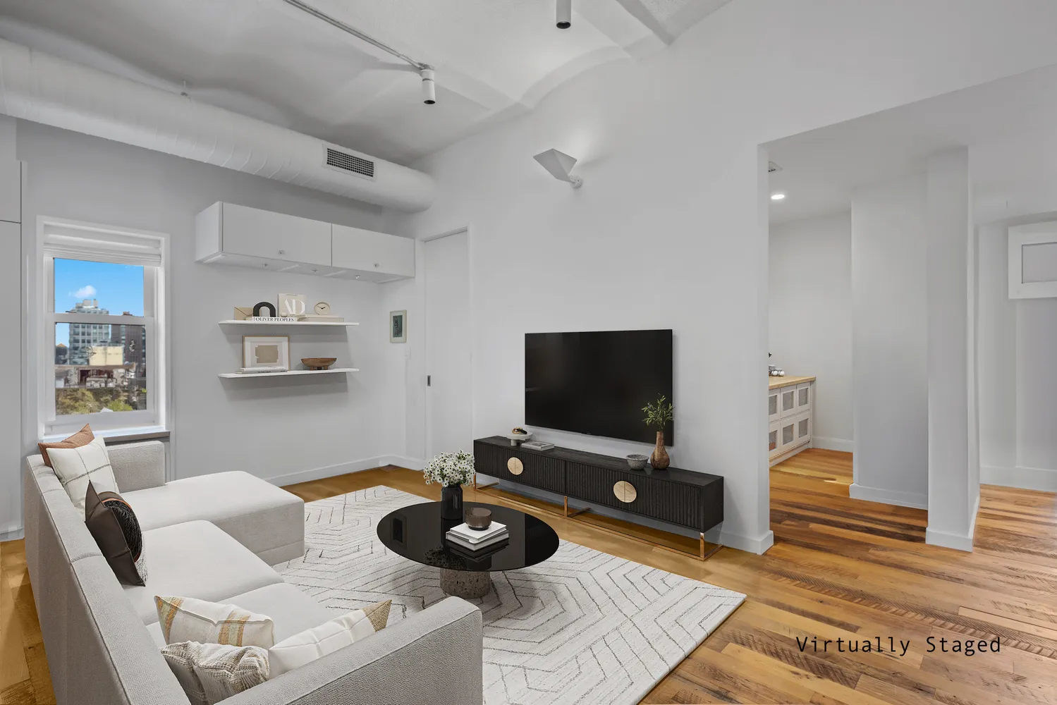 a living room with furniture and a flat screen tv