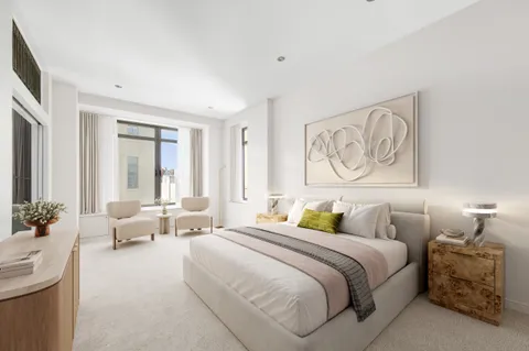 a bedroom with bed and furniture