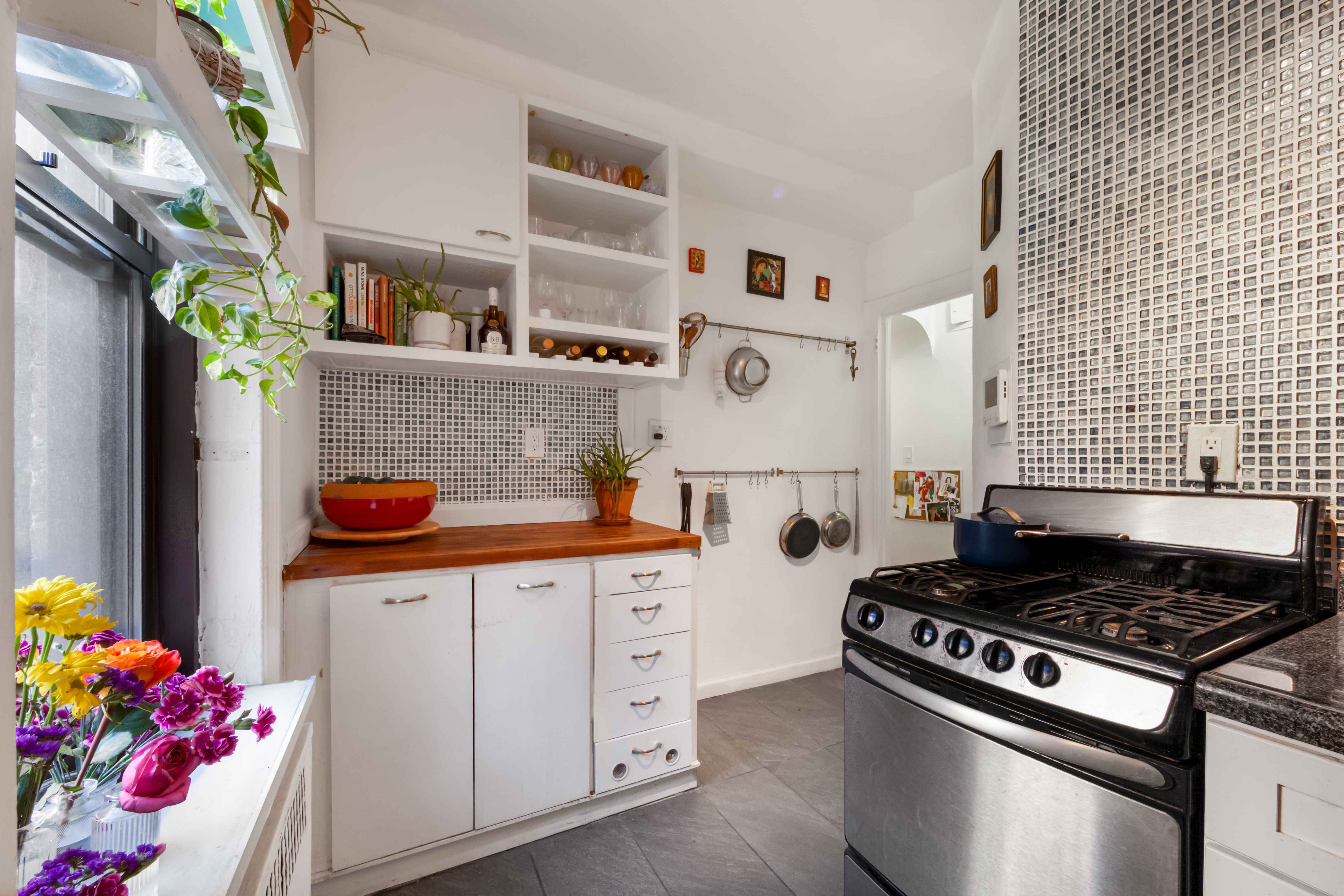 260 Ocean Parkway, Unit 5G Brooklyn, NY 11218 - Photo 8 of 10 a kitchen with stainless steel appliances granite countertop a stove and cabinets
