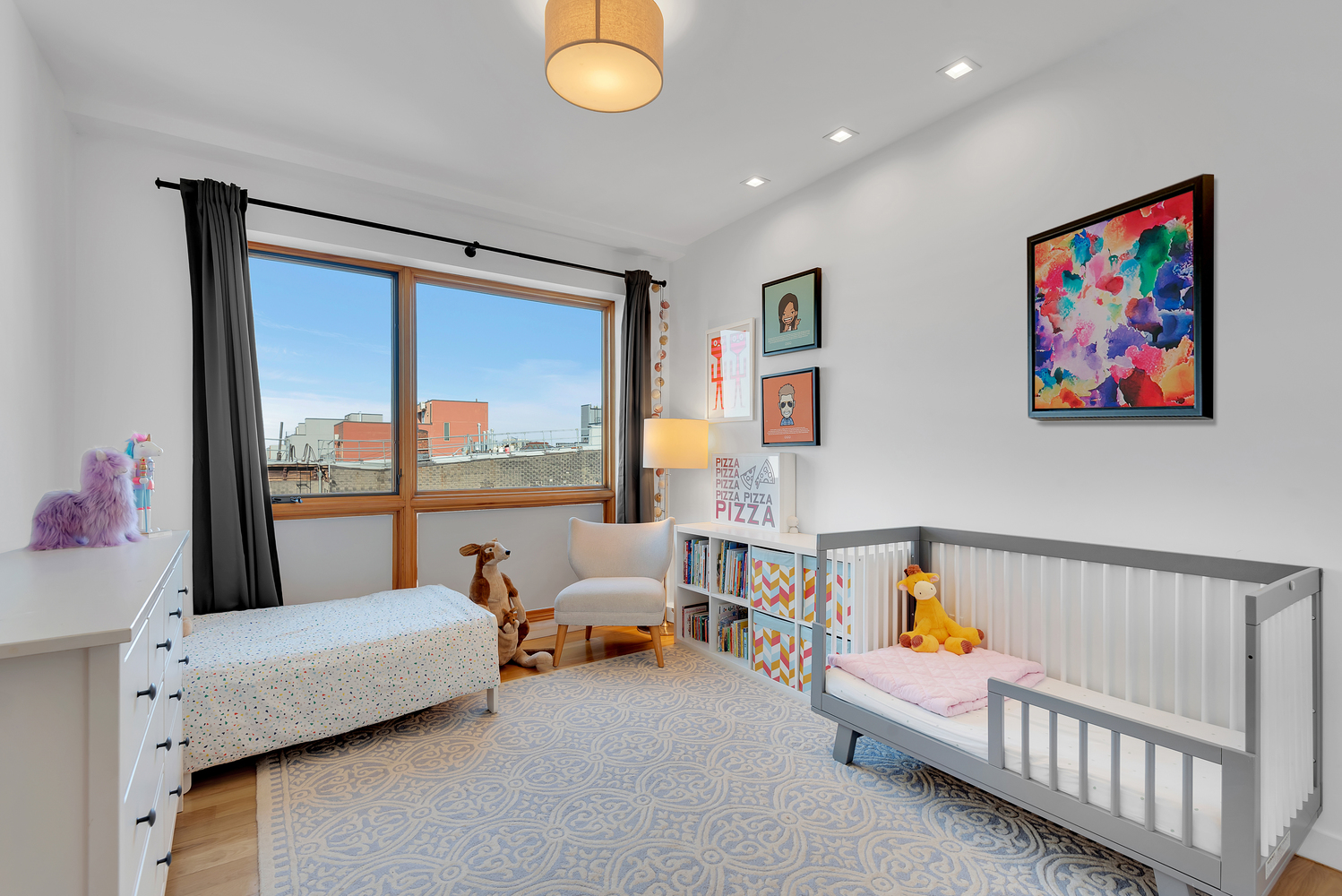 267 Evergreen Avenue, Unit PH Brooklyn, NY 11221 - Photo 12 of 19 a living room with furniture and a large window