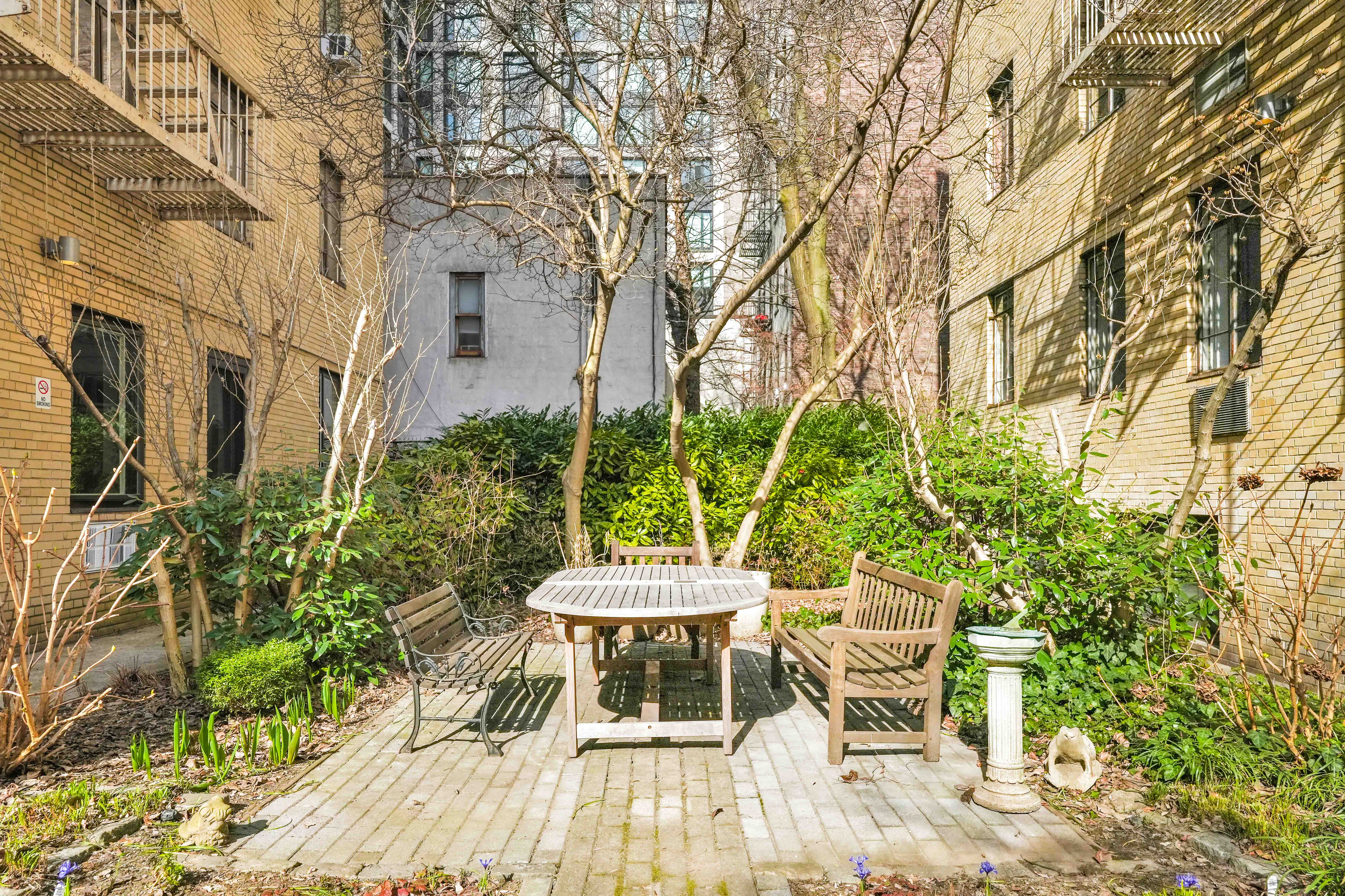 255 West 23rd Street, Unit 5GW Manhattan, NY 10011 - Photo 29 of 35 a view of a chairs and table in backyard