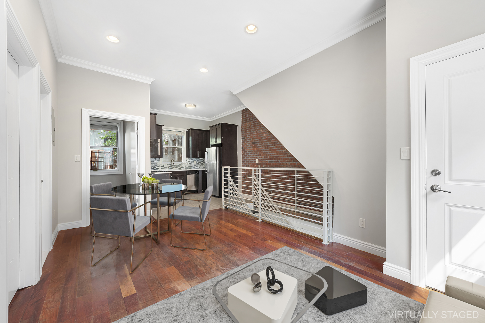 a living room with furniture and wooden floor