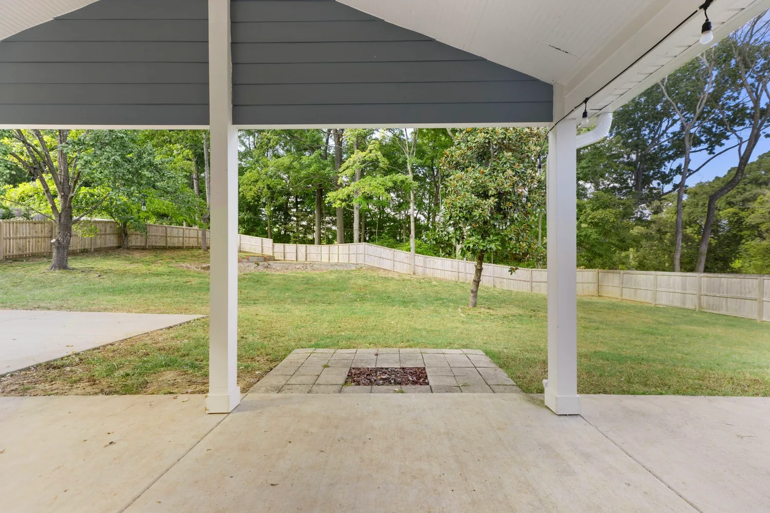a front view of a house with a big yard