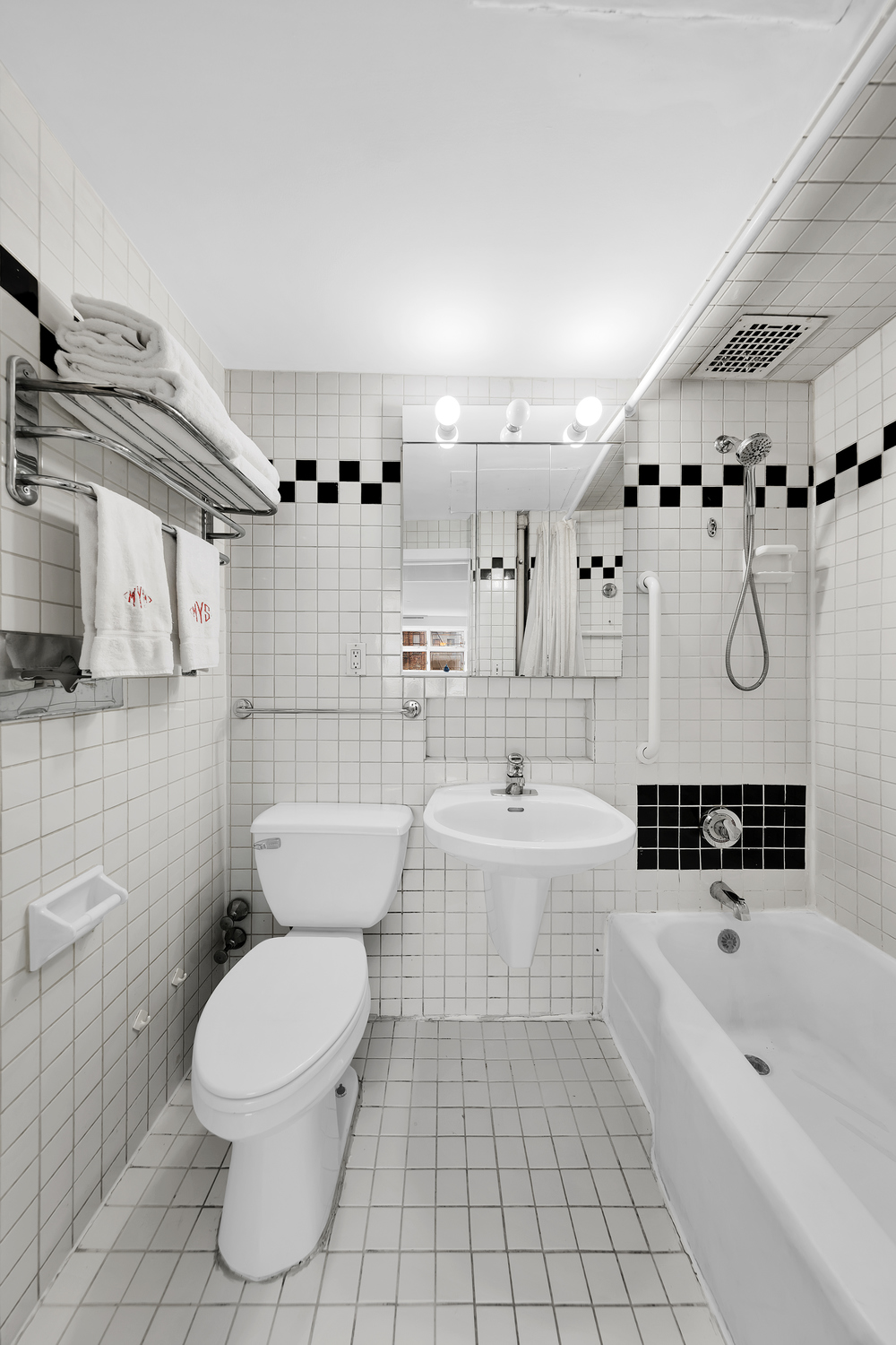 206 East 30th Street Manhattan, NY 10016 - Photo 11 of 17 a bathroom with a sink a toilet and shower