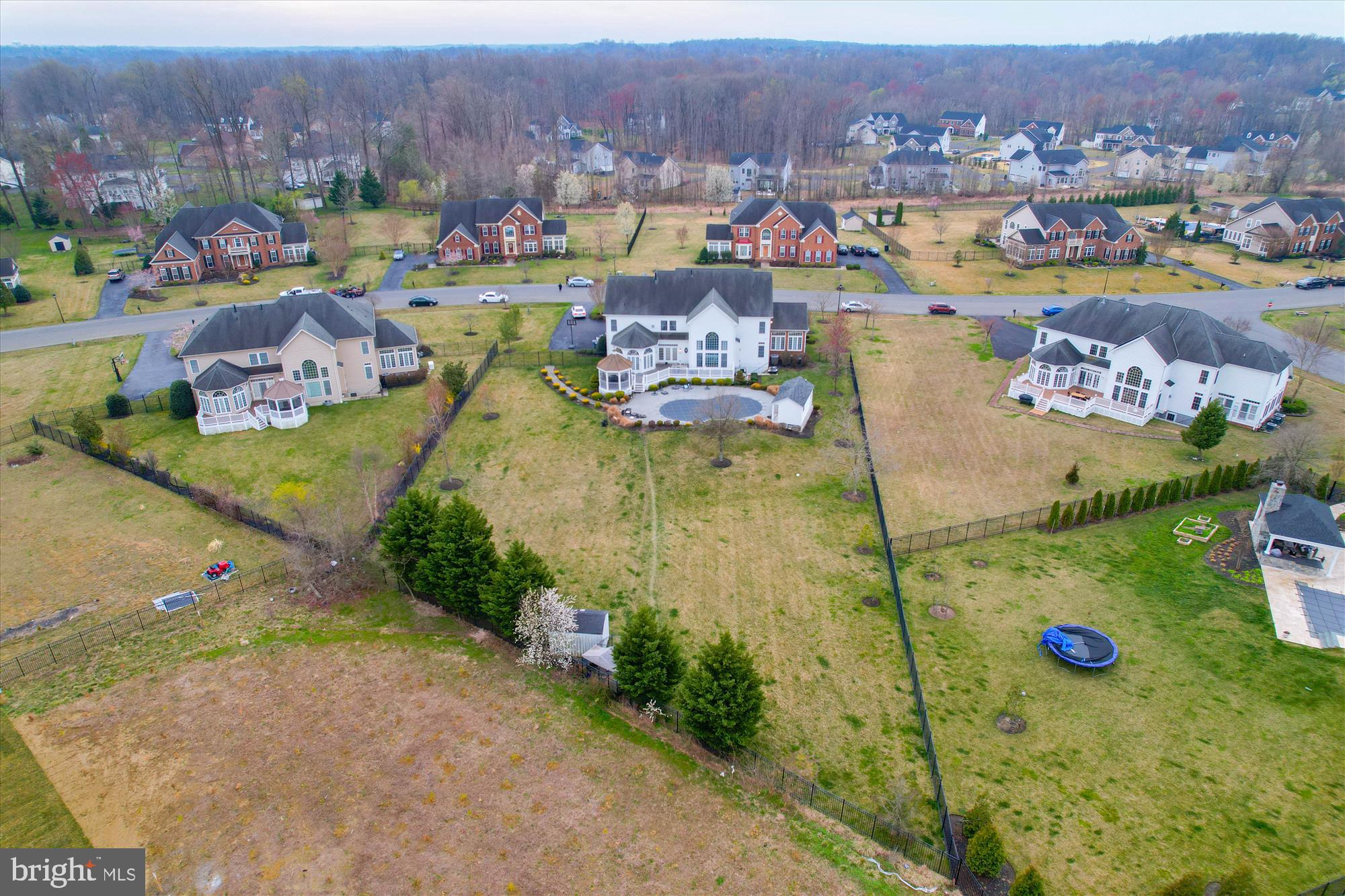 14302 Derby Ridge Road Bowie, MD 20721 - Photo 61 of 67 an aerial view of residential houses with outdoor space and swimming pool