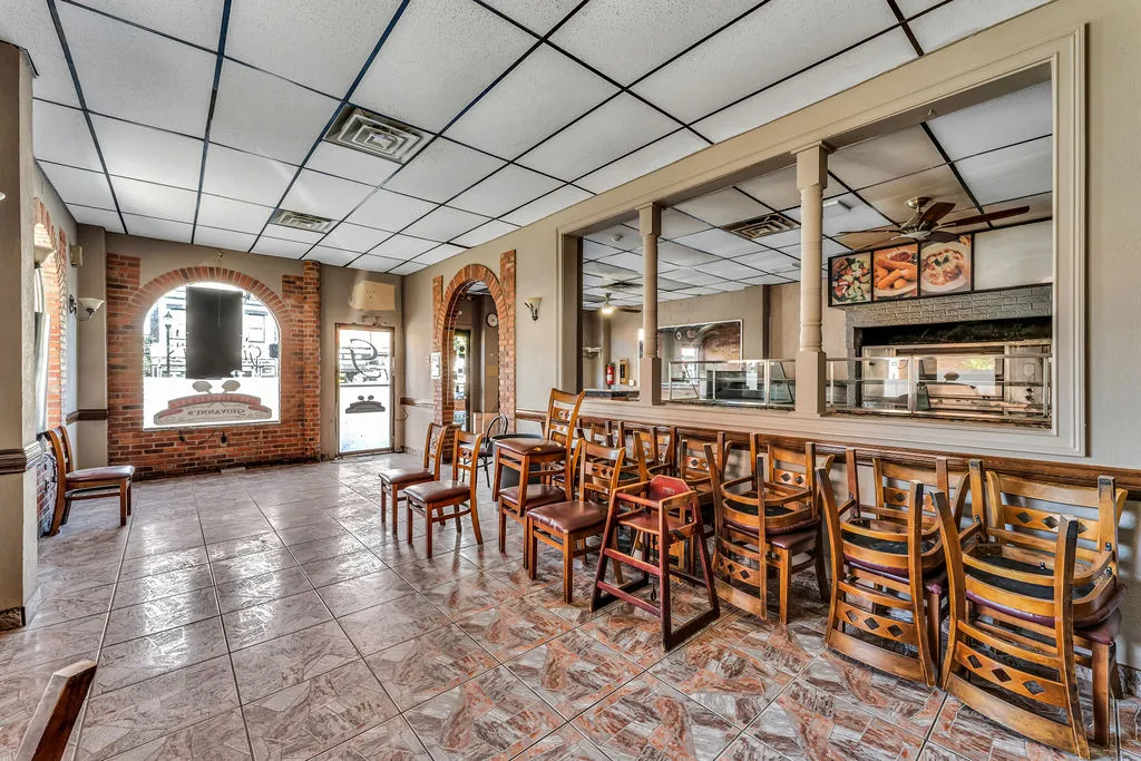 a view of a porch with furniture and a flat screen tv