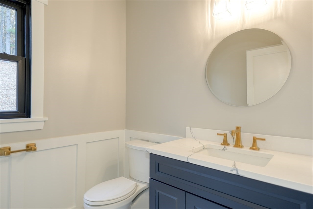 171 Randall Road Berlin, MA 01503 - Photo 18 of 41 a bathroom with a sink a toilet and mirror