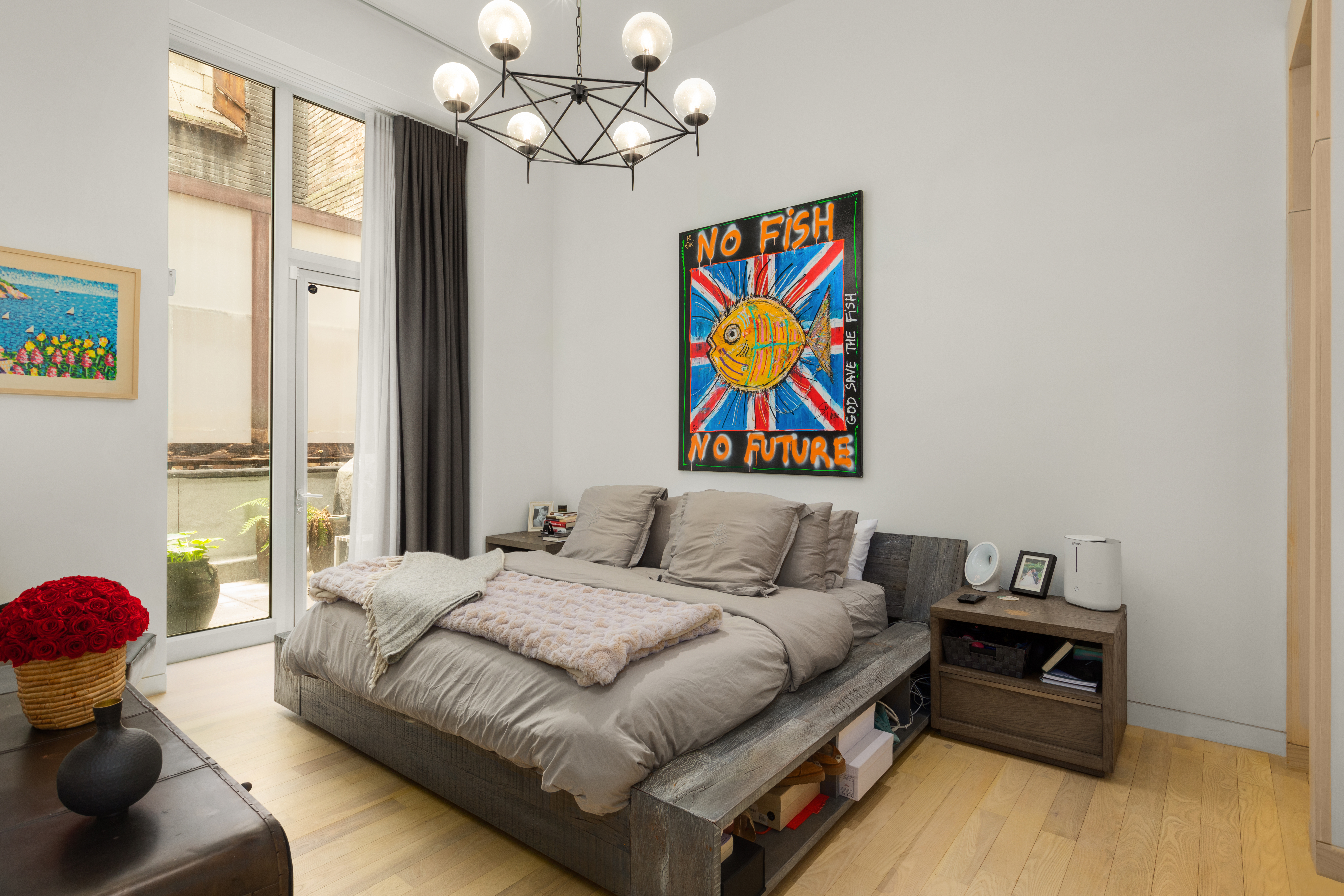 93 Reade Street, Unit 2 Manhattan, NY 10013 - Photo 4 of 9 a bedroom with a bed and wooden floor